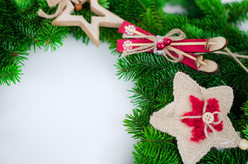 The Christmas wreath is decorated with New Year's toys, stars, skis.