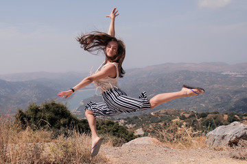 Beautiful girl flying in a landscape