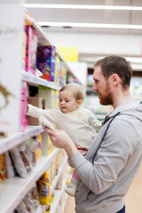 Obraz premium Dad with child buying products in store.