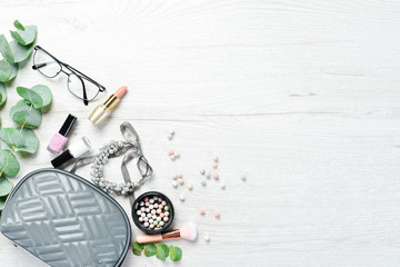 Women's cosmetic bag and accessories. Top view. Free copy space.