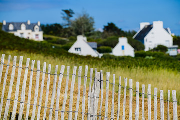 Fototapeta premium Breton houses behind a wooden fence, creative photography. Finister. Brittany. France