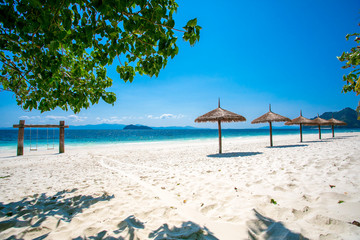 Fototapeta na wymiar Umbrella wooden on tropical beach.