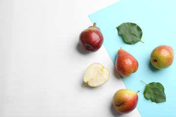 Ripe juicy pears on color background, flat lay. Space for text