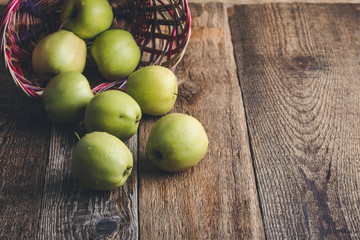 Fresh ripe  green apples In wicker  basket
