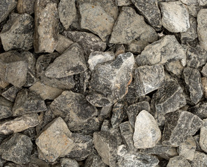 Vue gros plan d'une texture de pierre et rocher gris clair et foncé