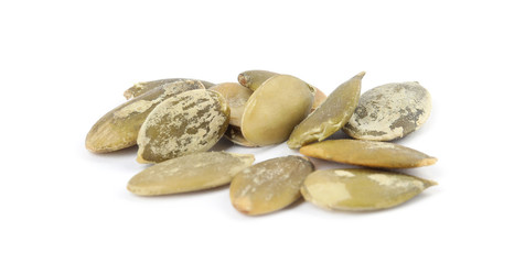 Raw peeled pumpkin seeds on white background