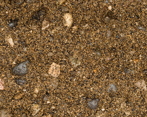 Vue gros plan d'une texture de pierre, gravier et sable fin orange et marron