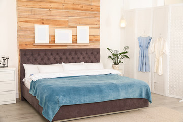 Modern folding screen in stylish bedroom interior