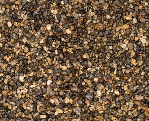 Vue gros plan d'une texture de pierre, gravier et sable marron et gris multicolore