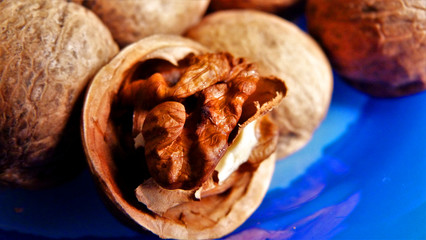 walnuts in the shell on black background