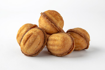 Tasty crunchy cookie: oatmeal, shortbread, chocolate, nutty, honey. Close-up isolated on a white background