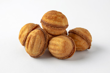 Tasty crunchy cookie: oatmeal, shortbread, chocolate, nutty, honey. Close-up isolated on a white background
