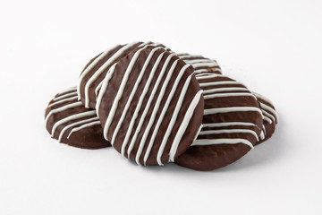 Tasty crunchy cookie: oatmeal, shortbread, chocolate, nutty, honey. Close-up isolated on a white background