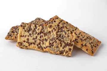 Tasty crunchy salty and spicy cookies: oatmeal, shortbread. Beer snack. Close-up isolated on a white background