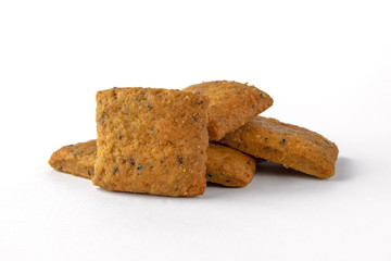 Tasty crunchy salty and spicy cookies: oatmeal, shortbread. Beer snack. Close-up isolated on a white background