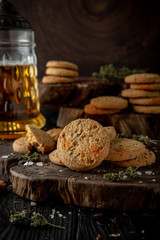 Snack for beer, alcohol. Crispy and crumbly delicious Salty and spicy cookies with seeds, chili peppers, spices and salt. Stylish still life for poster.