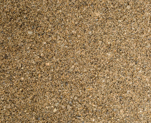 Vue gros plan d'une texture de pierre, gravier et sable fin orange et marron