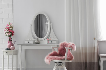 Stylish room interior with white dressing table
