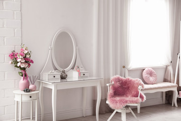 Stylish room interior with white dressing table