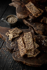 Snack for beer, alcohol. Crispy and crumbly delicious Salty and spicy cookies with seeds, chili peppers, spices and salt. Stylish still life for poster.