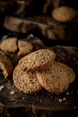 Snack for beer, alcohol. Crispy and crumbly delicious Salty and spicy cookies with seeds, chili peppers, spices and salt. Stylish still life for poster.