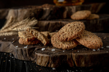 Snack for beer, alcohol. Crispy and crumbly delicious Salty and spicy cookies with seeds, chili peppers, spices and salt. Stylish still life for poster.
