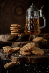Snack for beer, alcohol. Crispy and crumbly delicious Salty and spicy cookies with seeds, chili peppers, spices and salt. Stylish still life for poster.