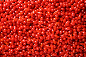 Fresh ripe goji berries as background, top view