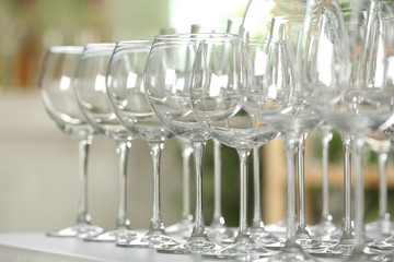 Empty glasses on table against blurred background