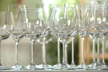 Empty glasses on table against blurred background