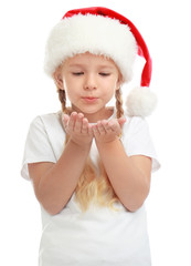 Cute little child wearing Santa hat on white background. Christmas holiday