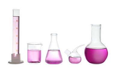 Laboratory glassware with purple liquid on white background