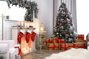 Beautiful decorated Christmas tree in living room interior
