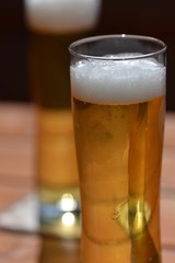 glass of beer on wooden table