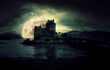 Fototapeta haunted mystic eerie Eilean Donan Castle in Scotland obraz