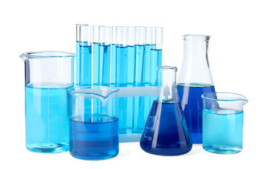 Laboratory glassware with blue liquids isolated on white