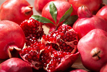 fresh ripe pomegranates with leaves