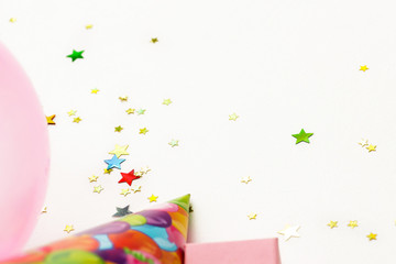 Birthday party background. party hats, balloons and confetti with copy space