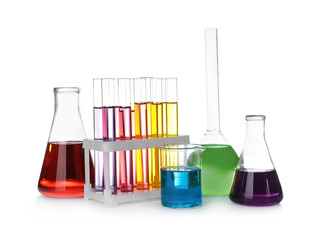 Laboratory glassware with color liquids on white background