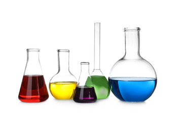 Laboratory glassware with color liquids on white background