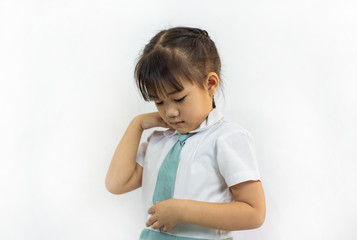Little kid practice fasten the buttons to dressing by herself. Learning to do activity daily living help the kids developt their self esteem and confident.