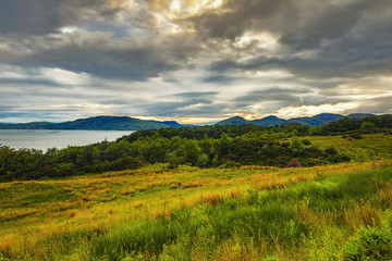 Beautiful scenic landscape of Scotland nature with beautiful evening sun set sky.