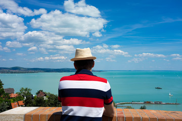 Man in hat enjoying the view of Lake Balaton from Tihany