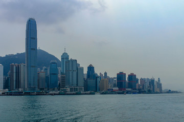 Skyline of Victoria Bay, Transportation Ships and Hongkong Island in the background taken from Kowloon. Hong Kong, China, Asia