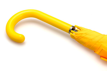 A yellow umbrella and its yellow arm. - Powered by Adobe