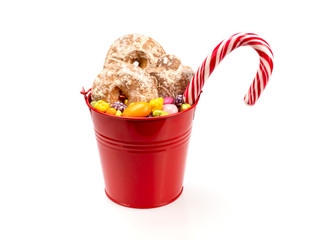 A bucket of Christmas gingerbread cookies and sweets.