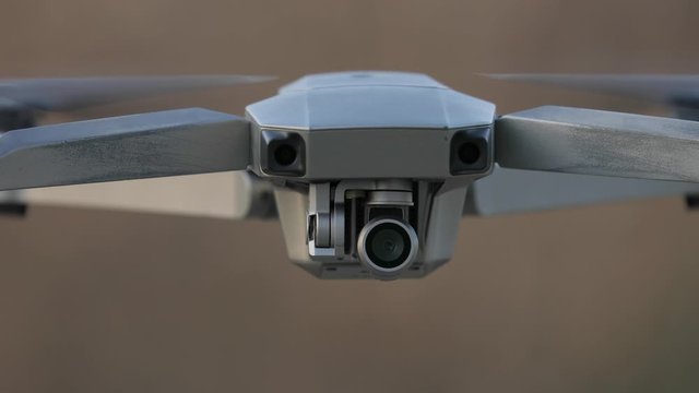 Drone flying outdoor closeup shot, camera tilting up