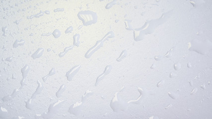 Waterdrops in dash on a white clean surface