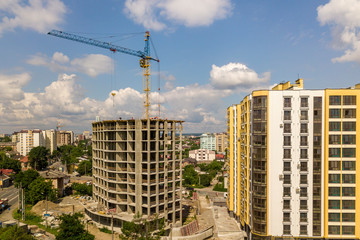Fototapeta na wymiar Apartment or office tall concrete building under construction.