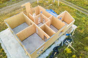 Construction of new and modern modular house. Walls made from composite wooden sip panels with...